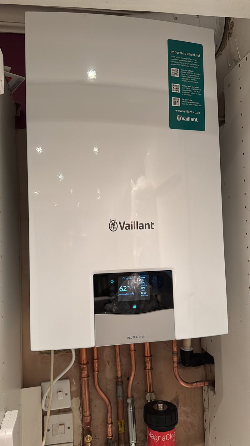 Vaillant boiler fitted in a kitchen cupboard, paired with smart controls
